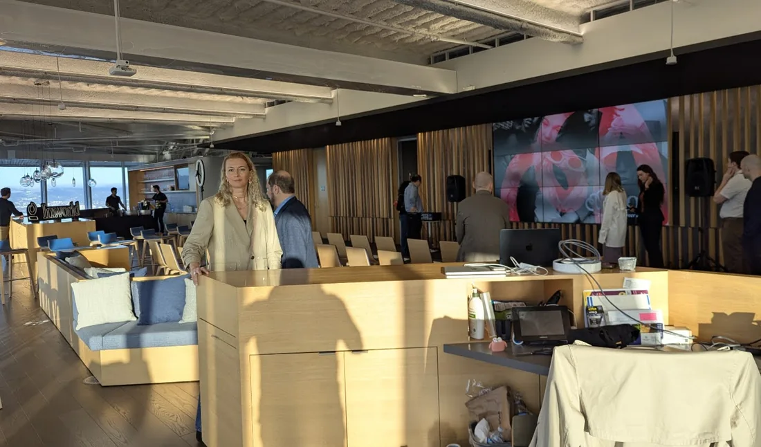 The O1SF host preparing inside a professional San Francisco event venue